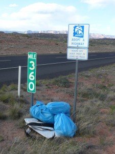 Arizona highway blue bags filled by litter clean up volunteers 