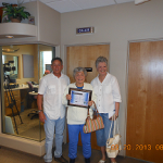 Yavapai County Unsung Hero Lois Hook accepts award from County Supervisor Chip Davis with Deanna King