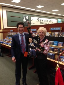 Genii Townsend presents her trademarked empowerment marionette to its likeness Pastor Joel Osteen