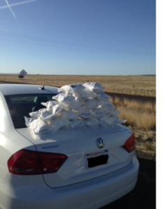 Packages of illegal marijuana seized from automobile backseat during a traffic stop