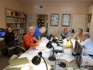 Archaeology Center volunteers at work cataloging artifacts in its Camp Verde lab